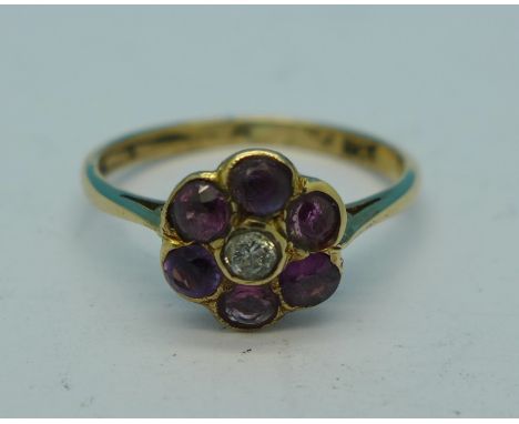 An 18ct gold, amethyst and diamond cluster ring, 2.2g, P