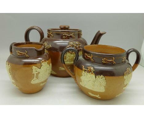 A Royal Doulton stoneware relief moulded three piece tea service