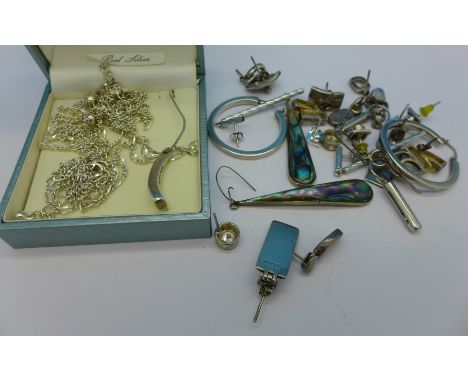 Silver jewellery including a pendant and chain, earrings and a three strand necklace