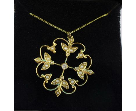 A 15ct gold, pearl and diamond pendant, replacement pin marked 9ct, on a fine silver gilt chain, 3.8g