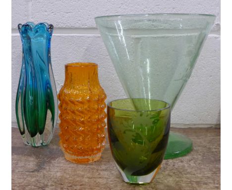 Four items of glass including a Whitefriars tangerine pineapple vase, designed by Geoffrey Baxter, one signed Peter M Brown, 