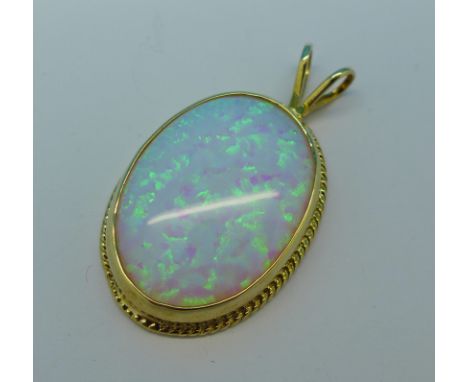 A 9ct gold and synthetic opal pendant, 5.8g, width 21mm