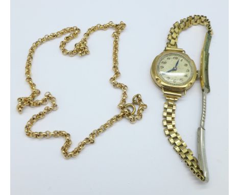 A lady's 9ct gold wristwatch, plated strap and a plated chain