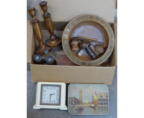 A Smiths ivory Bakelite clock, a pair of wooden candlesticks, a wooden bowl inset with shillings in date order 1946-1970, a b