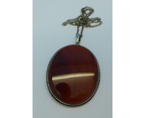 A large hardstone set pendant and chain