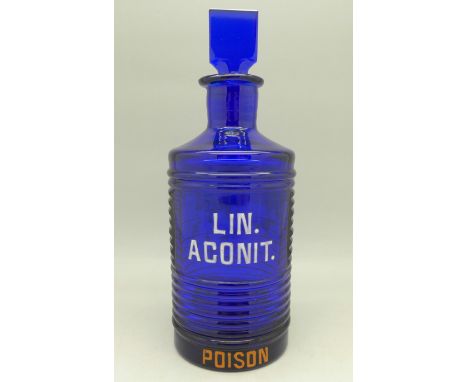A cobalt blue glass 'Poison' bottle with enamel lettering, 17.5cm