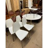 A Tulip type dining table together with a set of five laminated dining chairs