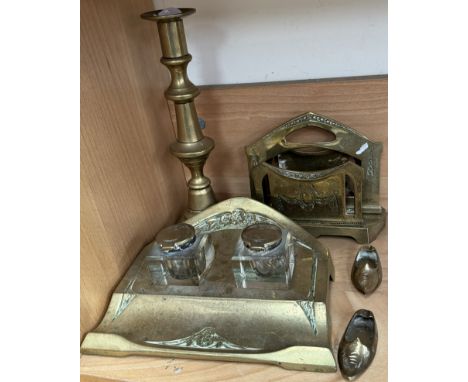 An Art Nouveau style brass desk standish together with a brass candlestick and letter rack 