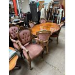 An Italian reproduction marquetry decorated dining suite comprising a dining table,