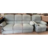 An upholstered reclining three seater settee and matching arm chair