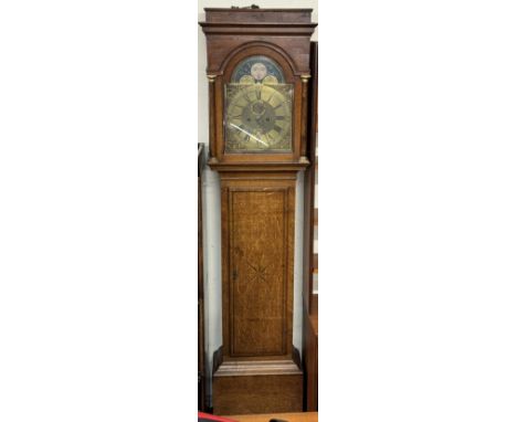 A 19th century oak long case clock with a caddy top and three quarter columns above a long trunk door and box base, the 30cm 