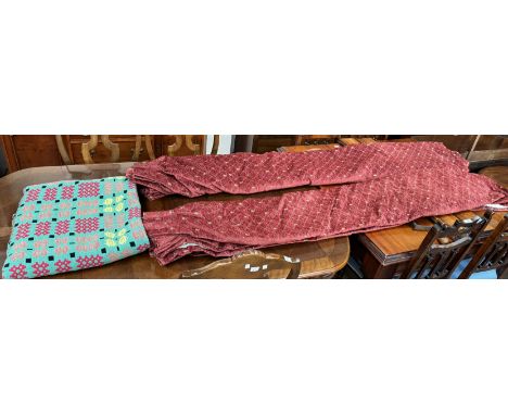 A Welsh blanket  with geometric patterns to a green ground together with a pair of curtains