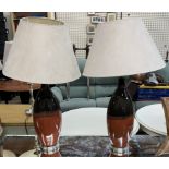 A pair of pottery two tone table lamps
