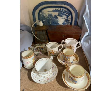 A Coalport cabinet cup and saucer decorated with birds amongst trees together with commemorative teacups, saucers and mugs, b