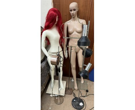 Two mannequins, one on casters together with a metal mannequin and two chrome standard lamps