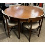 A G-Plan teak extending dining table and four chairs