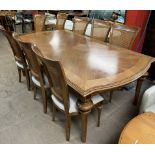 A modern walnut extending dining table 217cm long x 121cm wide x 78cm high,