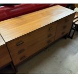 A mid-20th century G-Plan teak chest with a rectangular top above six drawers on shaped legs 131cm