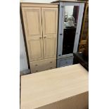 A modern wardrobe with matching chest of drawers together with a wardrobe with a mirrored door