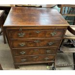 An 18th century style walnut chest with a rectangular crossbanded top above a brushing slide and