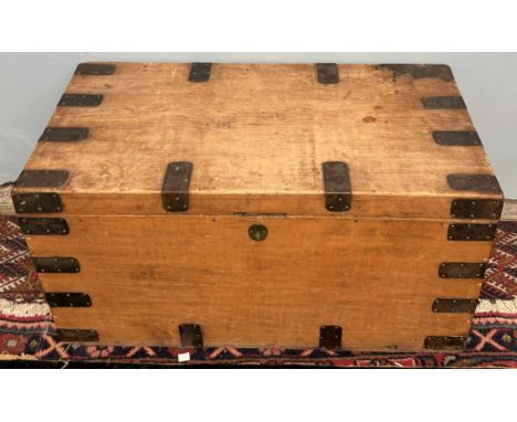 A pine trunk bound with metal mounts 