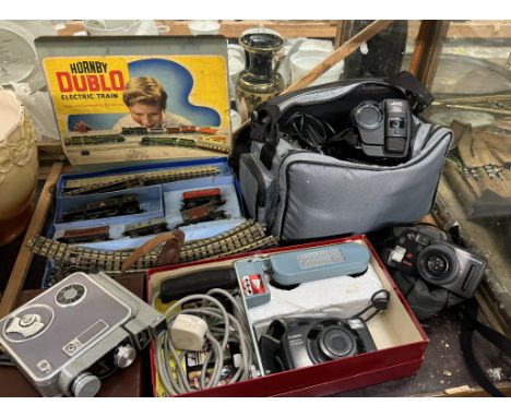 A Hornby electric train set together with assorted cameras including a Admira 8f, Canon Sure shot, Olympus, a JVC video camer