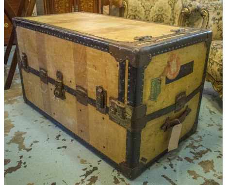 STEAMER TRUNK, early 20th century American canvas, metal bound and hinged to enclose interior drawers and hanging space (bear