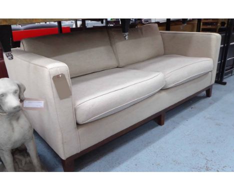 SOFA, two seater, contemporary design in oatmeal upholstery on darkened splayed legs, 200cm L x 97cm W x 85cm H (with faults)