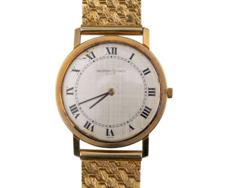 Circa 1956, An 18 ct. yellow gold Vacheron Constantin ultra thin watch, on a mesh link 18 ct. yellow gold bracelet. Model 635