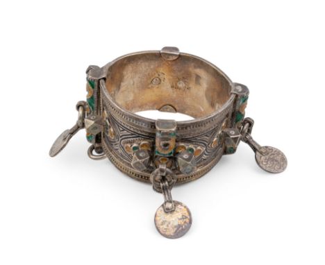 An antique North African tribal, probably Berber, silver metal and green and yellow enamel cuff Hinged&nbsp;with a push pin c
