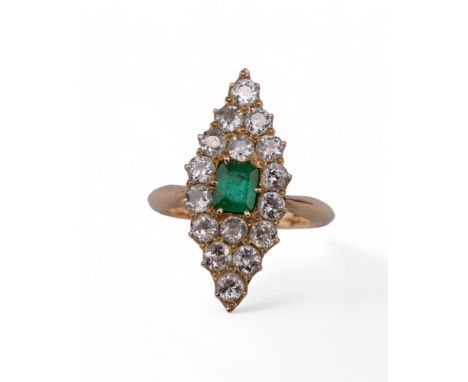 British, late Victorian,  a diamond and emerald dress ring. The marquise shaped pavé set diamond top with a centrally set rec