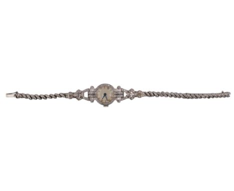 Continental Circa 1920 A diamond set cocktail watch, in either platinum or white gold. The circular dial with brilliant cut d