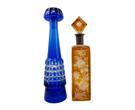 20th century Two glass decanters. To include: [a] German, A flash glass decanter with silver top and lozenge glass stopper. T