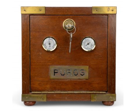 20th century A mahogany humidor with brass corners, on ball feet. With a thermometer and hygrometer to the front. Contains a 
