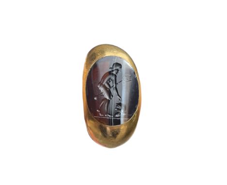 Antique, Possibly Ancient A banded agate intaglio ring of an Axeman standing above a severed soldier's head.&nbsp; Dimensions
