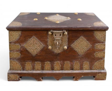 Middle Eastern, Antique A mahogany trunk with intricately decorated brass plates to the corners, sides and top. With internal