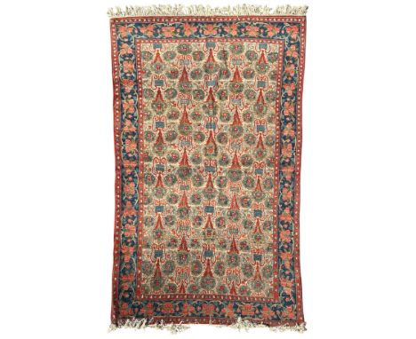A West Persian, probably Feraghan rug c.1960  The ivory field with a one way design and semi naturalistic plants enclosed by 