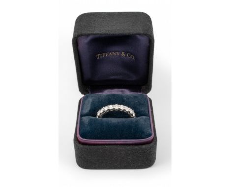 Tiffany &amp; Co.  Embrace diamond eternity ring. Mounted in platinum Signed and numbered With original Tiffany box (Tiffany 