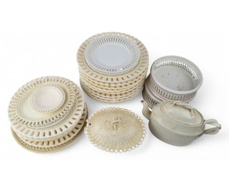 A collection of creamware, to include: [a] Two wine coasters [b] A butter dish and plate [c] A teapot [d] Eighteen dishes and