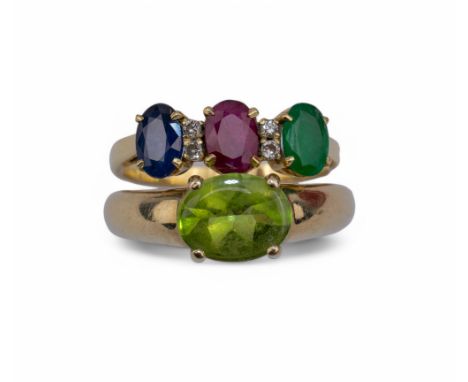 Two rings, comprising: [a] A single stone peridot and gold ring, ring size: N [b] An emerald, ruby and sapphire three stone r
