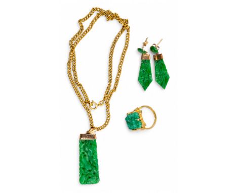 Chinese Circa 1920 An attractive emerald green pierced and carved jadeite pendant, with double gourds and peaches. On a heavy