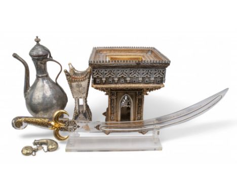 To include: [a] A silver metal bakhoor incense burner. [b] A metal water pitcher. [c] A table centrepiece in the shape of a t