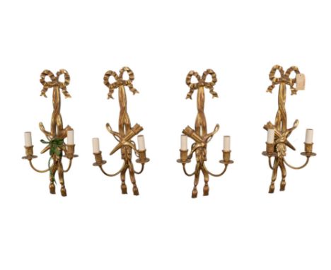 British A set of four Georgian carved and gilded two branch wall sconces. With bow and arrow central decoration&nbsp;  To be 