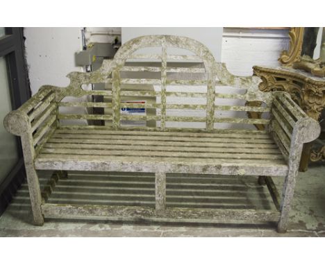 LUTYENS STYLE GARDEN BENCH, vintage weathered silvered teak after a design by Edwin Lutyens, arched and slatted, 165cm W.