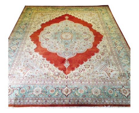 FINE TABRIZ DESIGN CARPET, 325cm x 245cm, central medallion on a terracotta field within oversized spandrels and a repeat pal