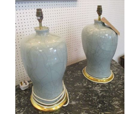 LAMPS, a pair, Chinese style celadon ceramic with crackelure finish and giltwood supports, 46cm H. (2)