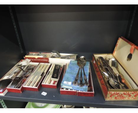 A selection of vintage flatware including boxed
