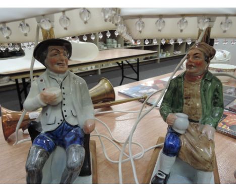 A pair of decorative ceramic table lamps, modelled as figures 'Tam O Shanter' and 'Souter Jonnie'