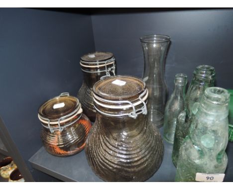 A selection of glass jars and vintage bottles including Barrow and Northallerton interest