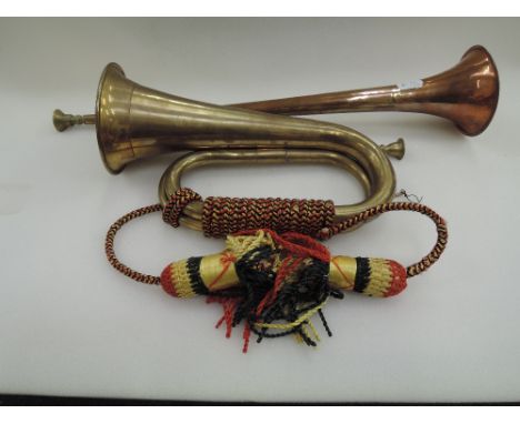 A copper horn and brass bugle